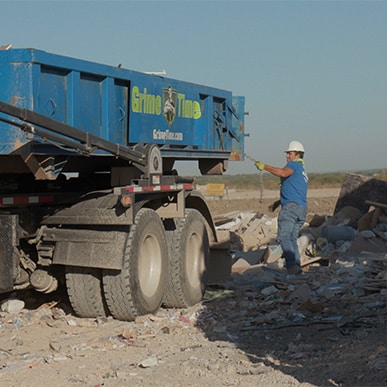 unloading a rental dumpster